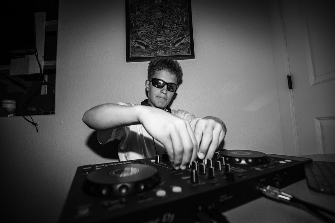 Black and white photograph of a DJ performing